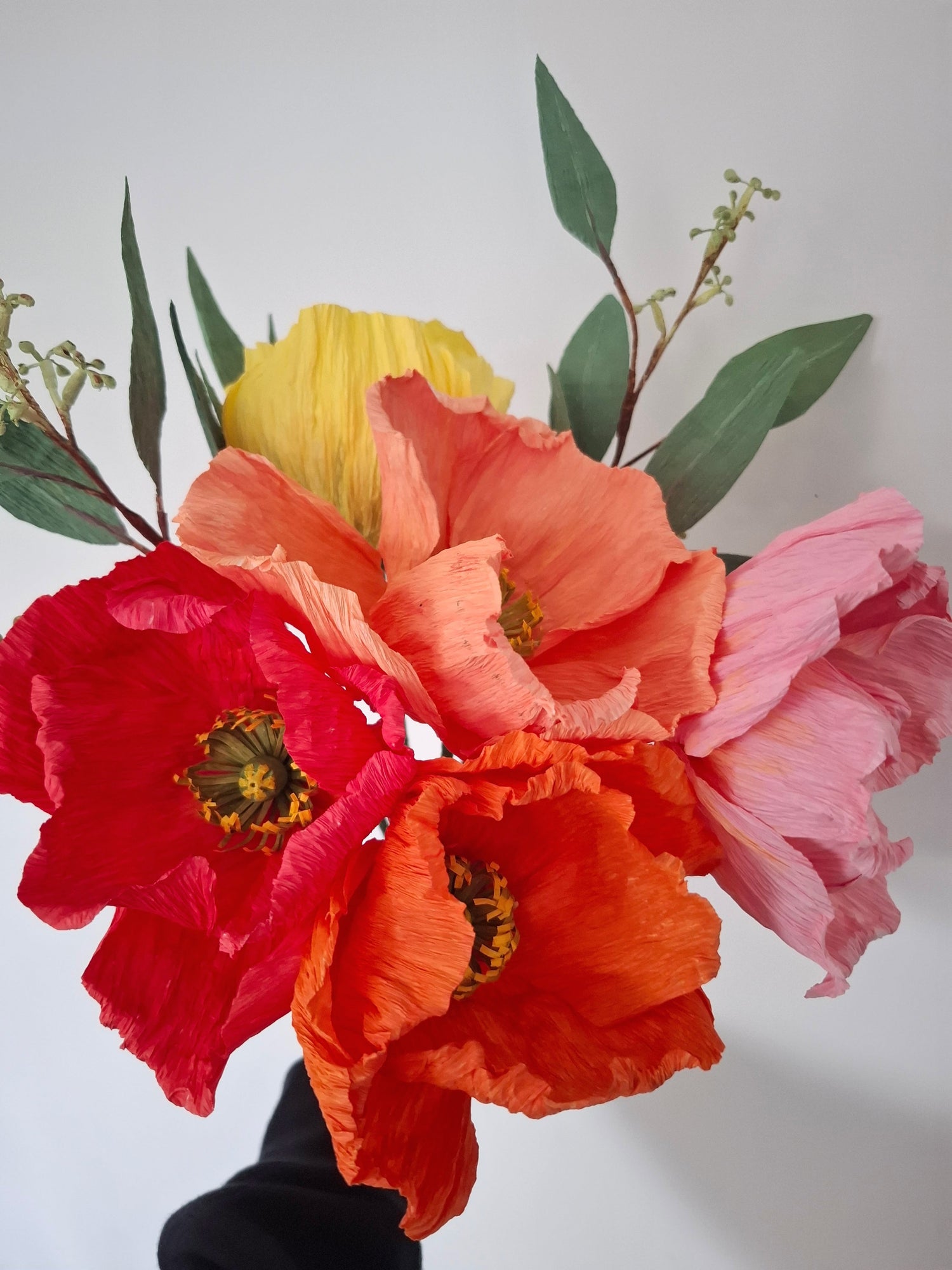 Crepe paper eucalyptus and poppy flowers